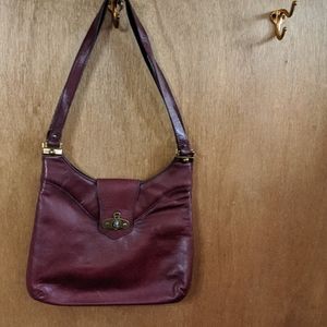 Vintage Etienne Signer handmade burgundy leather